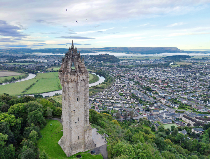 Wallace monument stirling birds circling monument city and castle in background